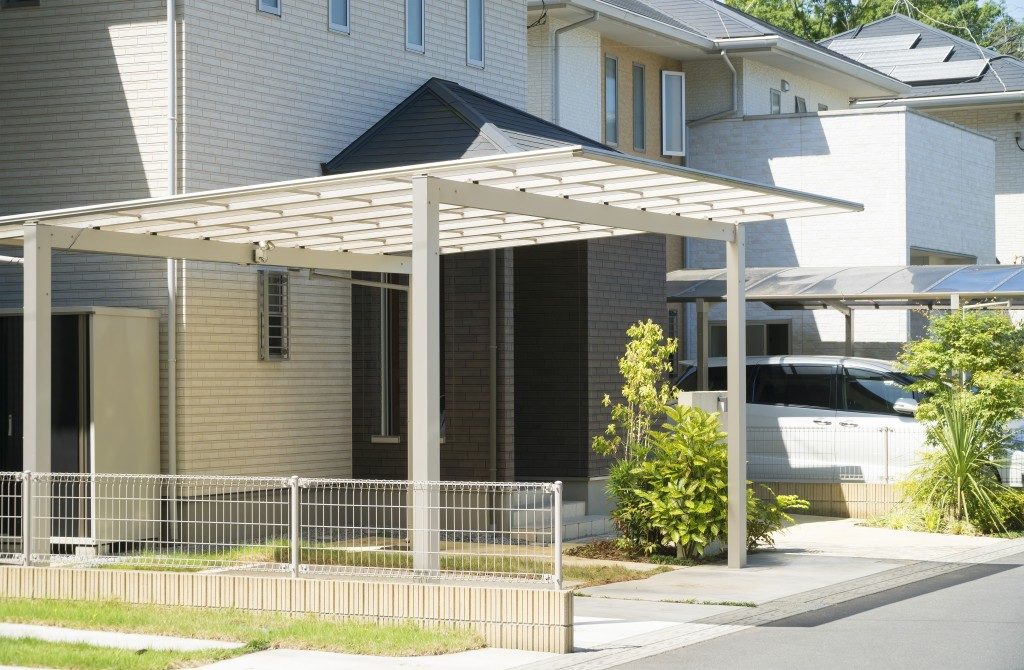 white residential car port