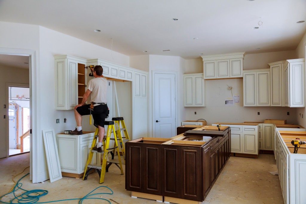 man renovating room