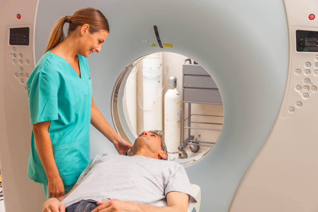 nurse assisting their patient before going in the CT scan