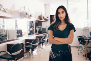 Business woman in front of her salon