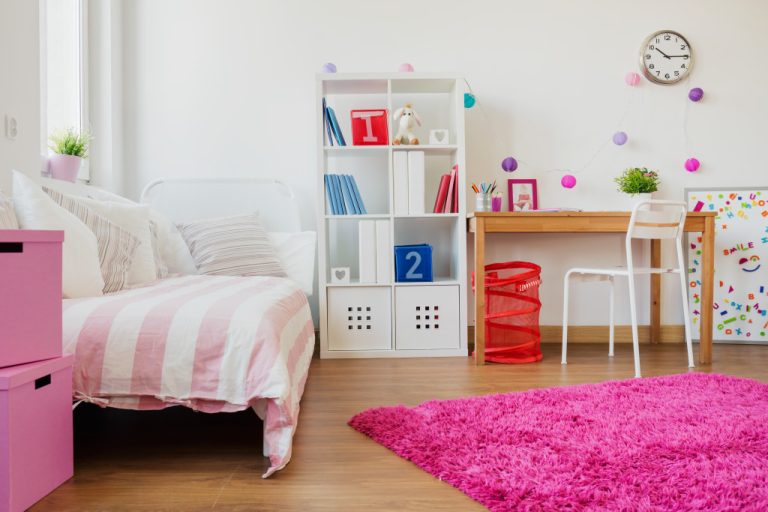 A trendy bedroom ful of pink stuff for a young person