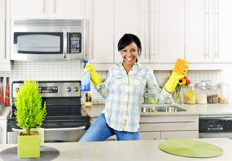 A homeowner happily cleaning