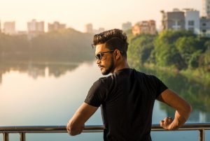 Summer shot of a man on a river