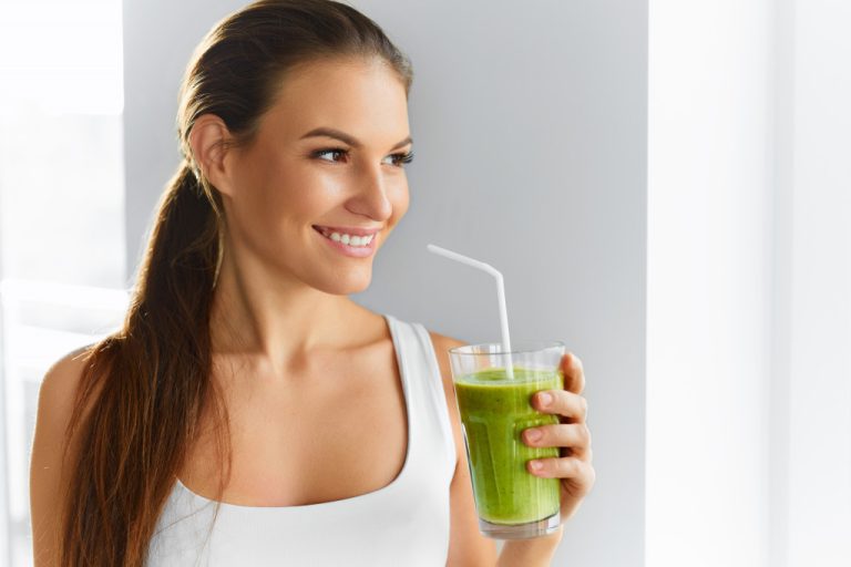 beautiful woman drinking a healthy smoothy
