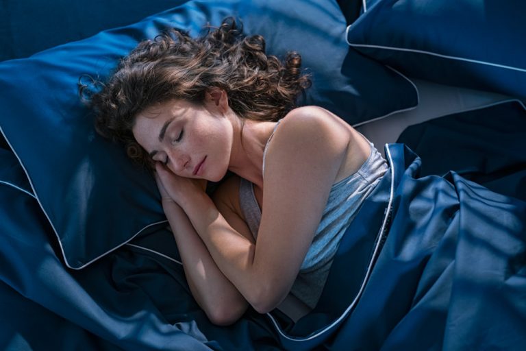 woman sleeping in her bedroom