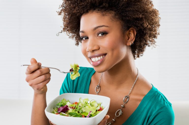 A woman Eating salad